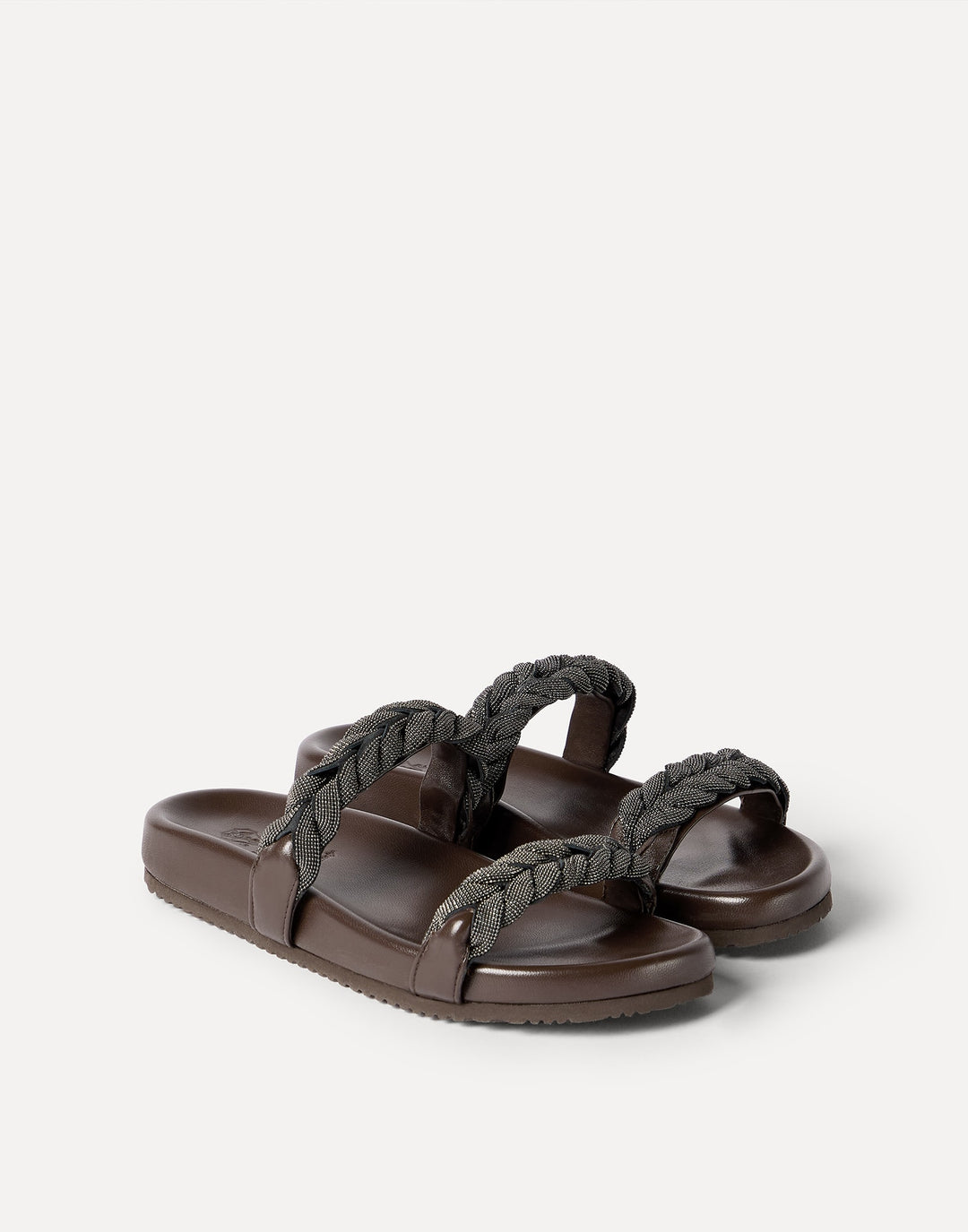 Brown sandals with braided straps on a white background