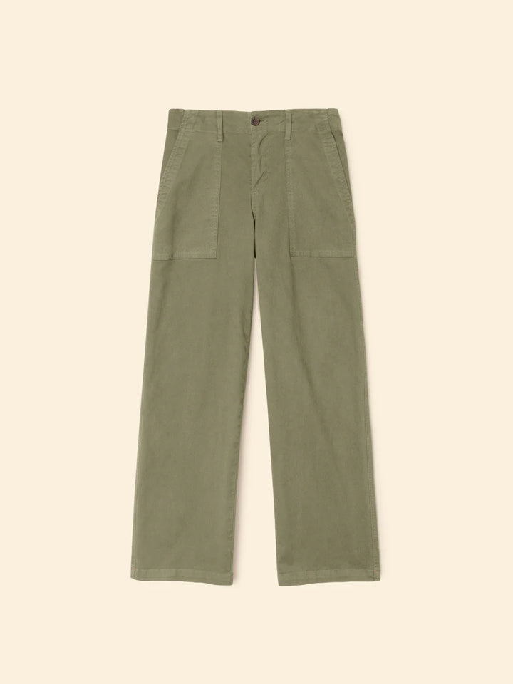 Green pants on a beige background