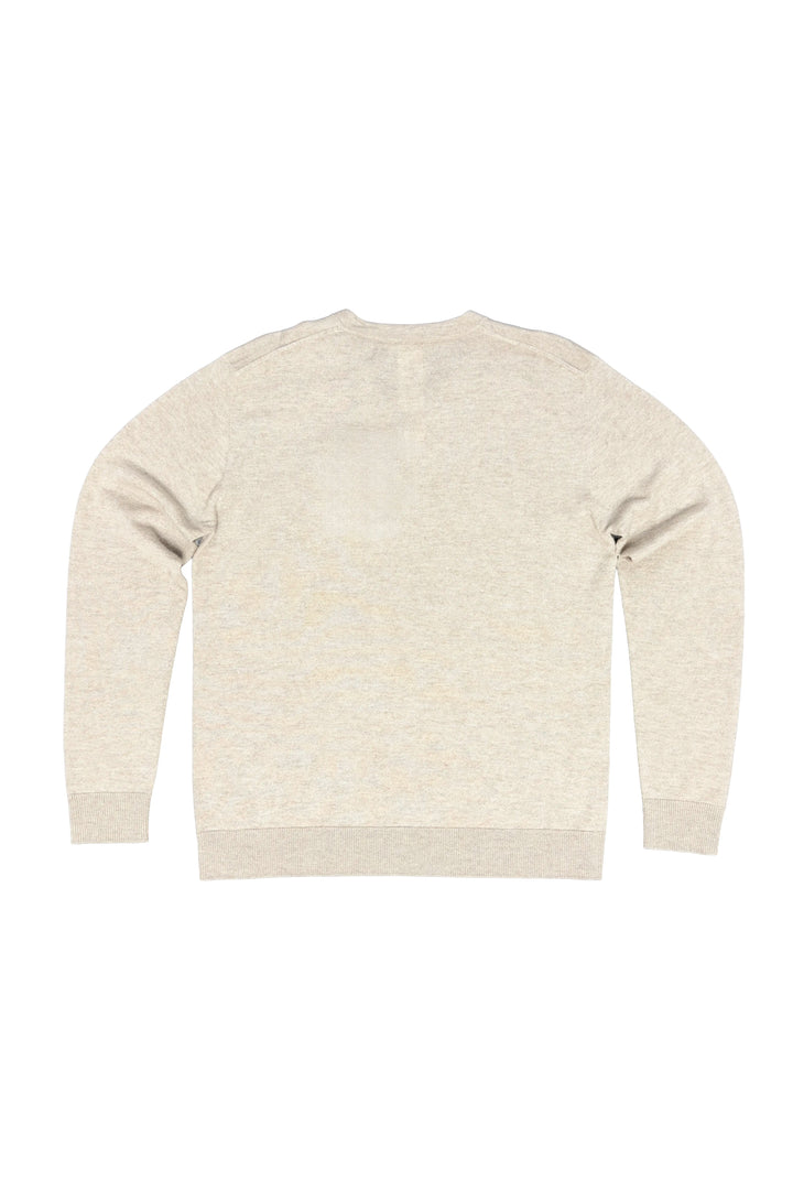 Beige sweater on a white background