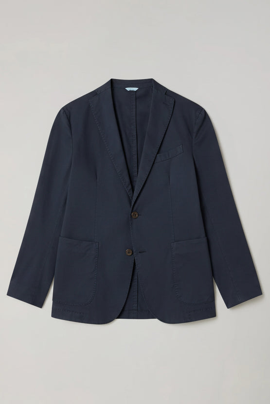 Green blazer on a light gray background