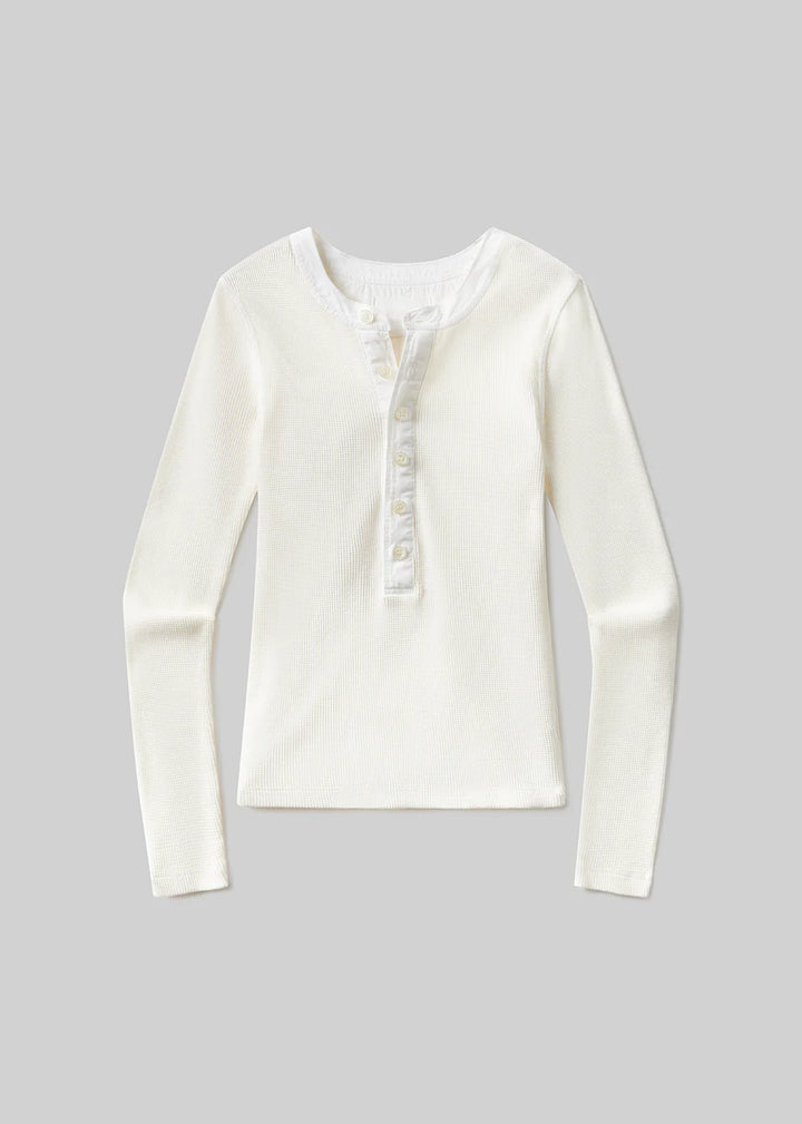 White long-sleeve shirt on a gray background