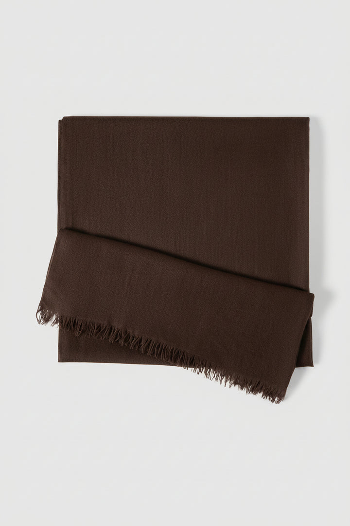 An olive green folded scarf with fringed edges, displayed on a clean light gray background.