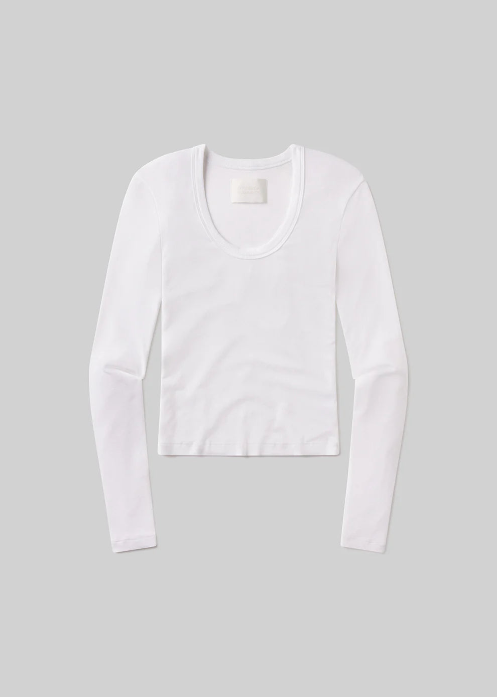 White long-sleeve shirt on a gray background