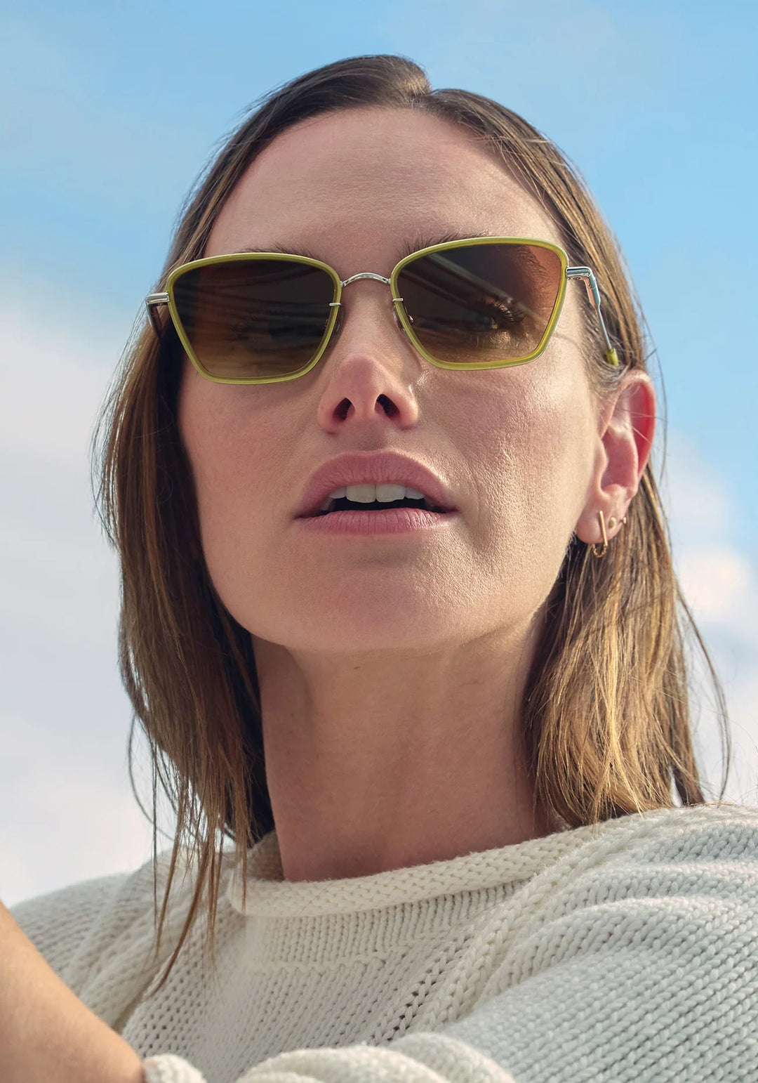 Woman wearing sunglasses with a blurred background