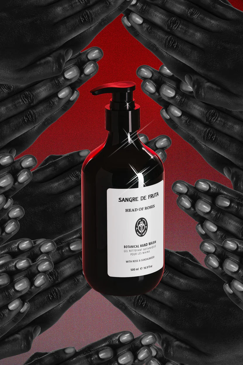 Black bottle with a label on a red background with black hands.