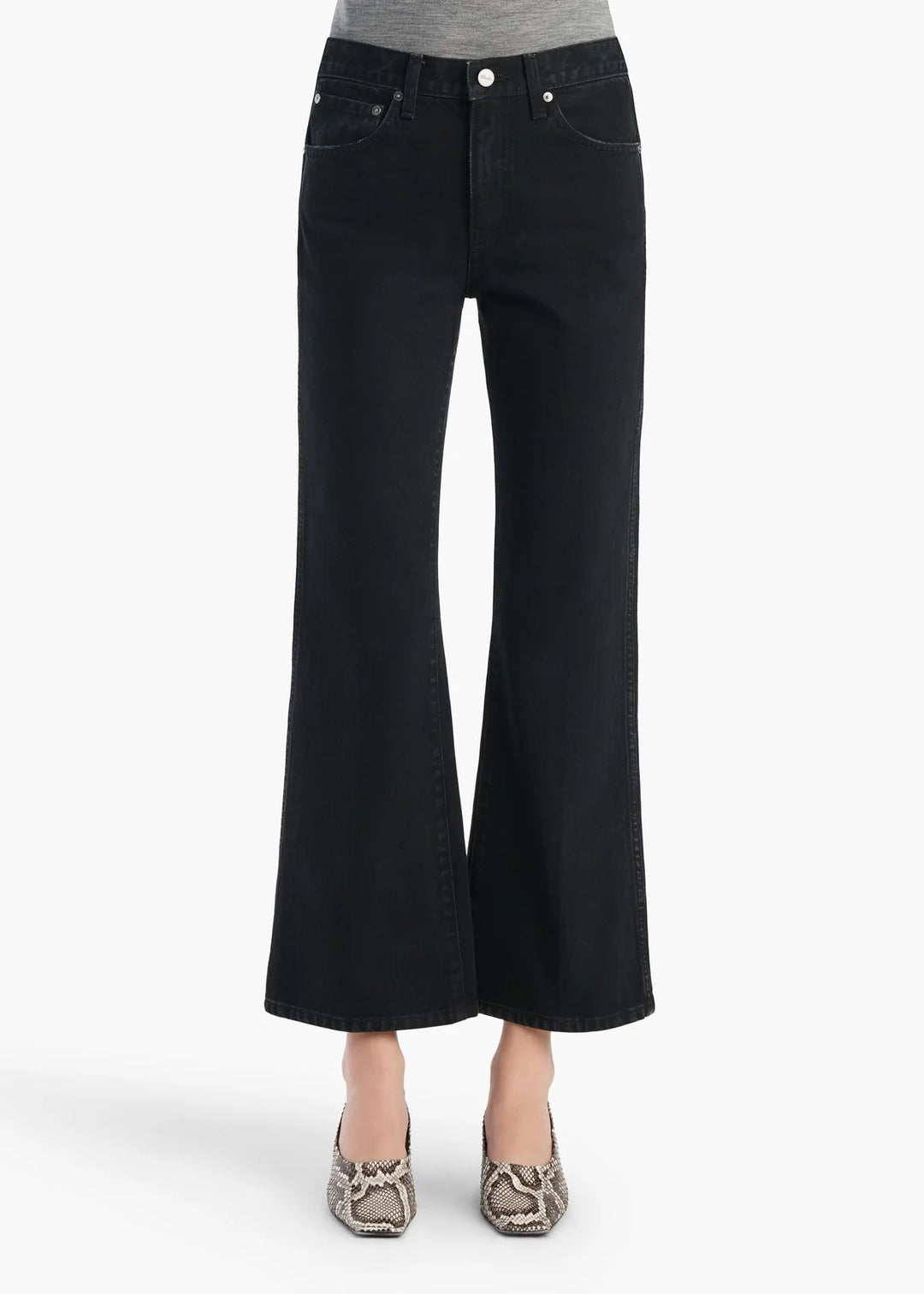 Black wide-leg jeans worn by a person on a white background