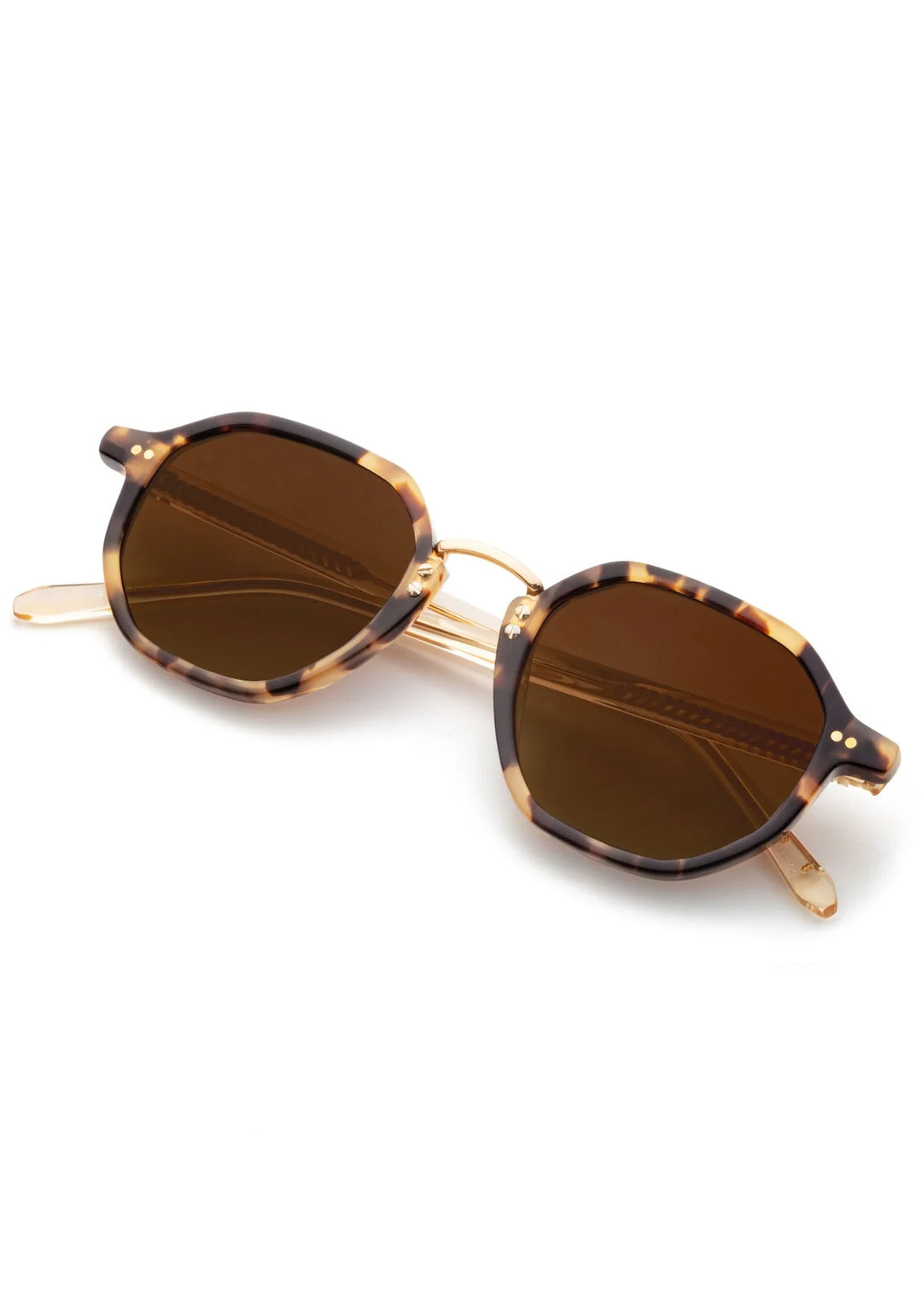 Round sunglasses with brown lenses and gold frame on a white background