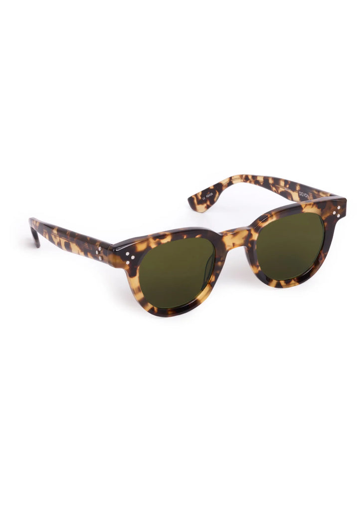 Sunglasses with tortoiseshell frame and dark lenses on a white background