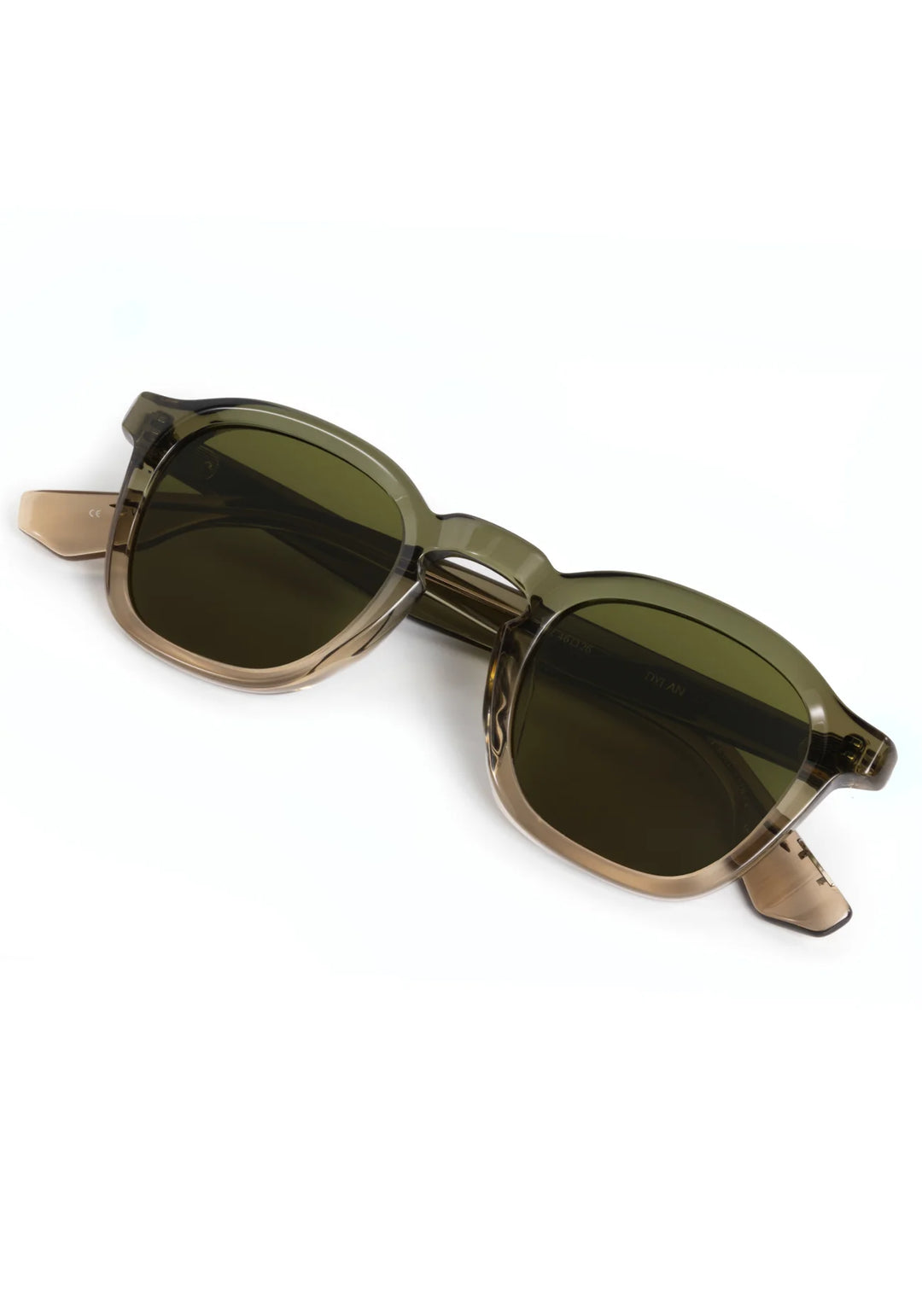 Sunglasses with green lenses and gold frames on a white background