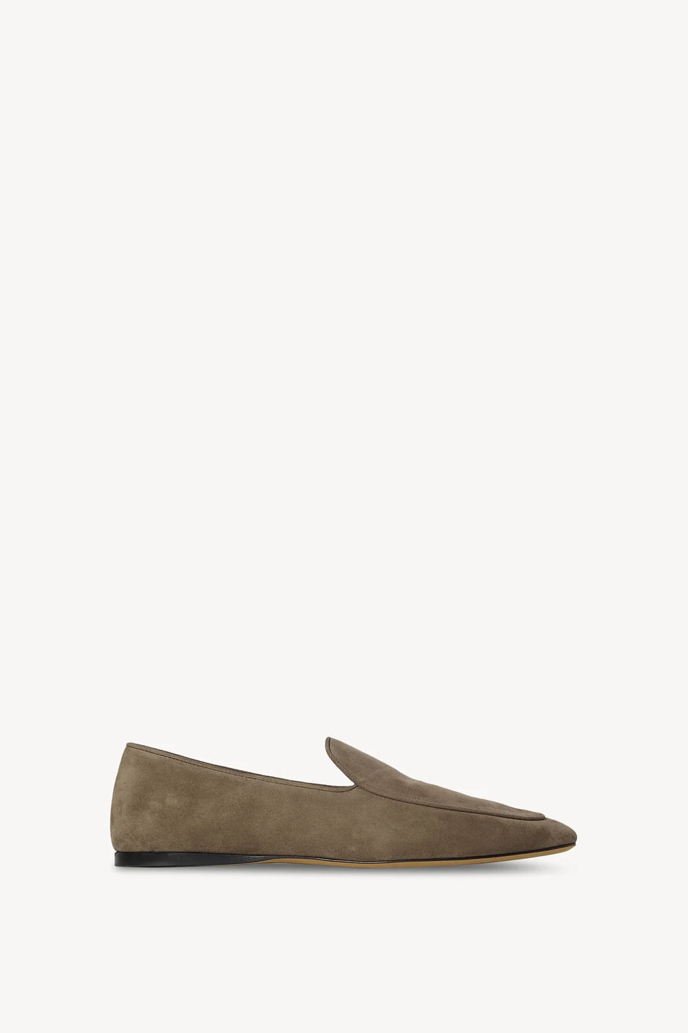 Brown suede loafer on a white background
