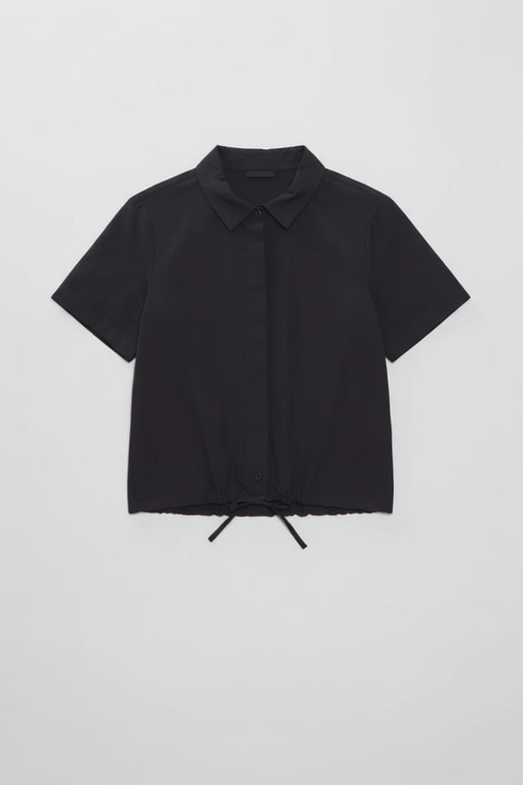 Black short-sleeve shirt with a collar on a light gray background