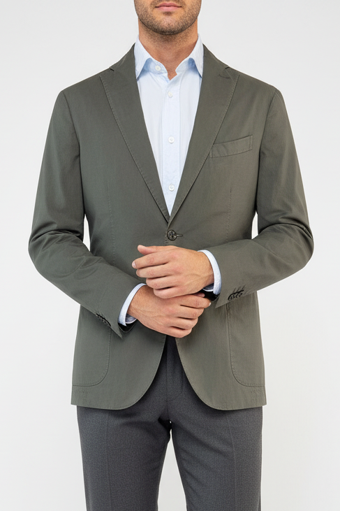 Man wearing a gray suit jacket and pants on a white background
