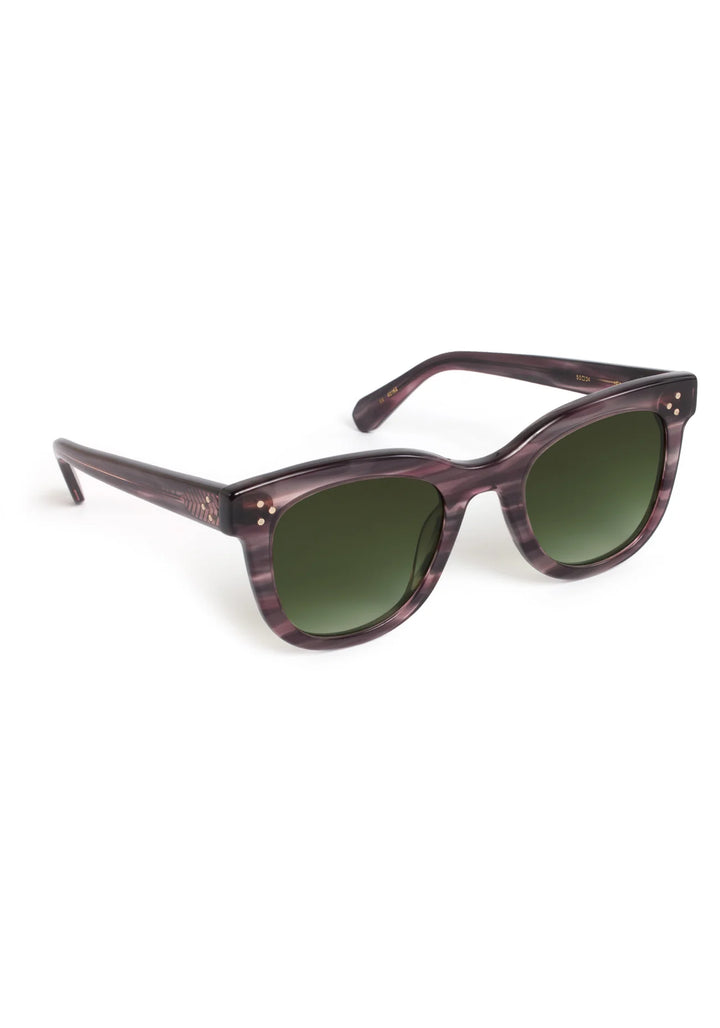 Sunglasses with purple frame and green lenses on a white background
