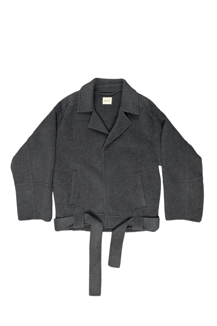 A dark gray wool-blend jacket with a collar, patch pockets, and a matching waist tie belt, laid flat against a white background.