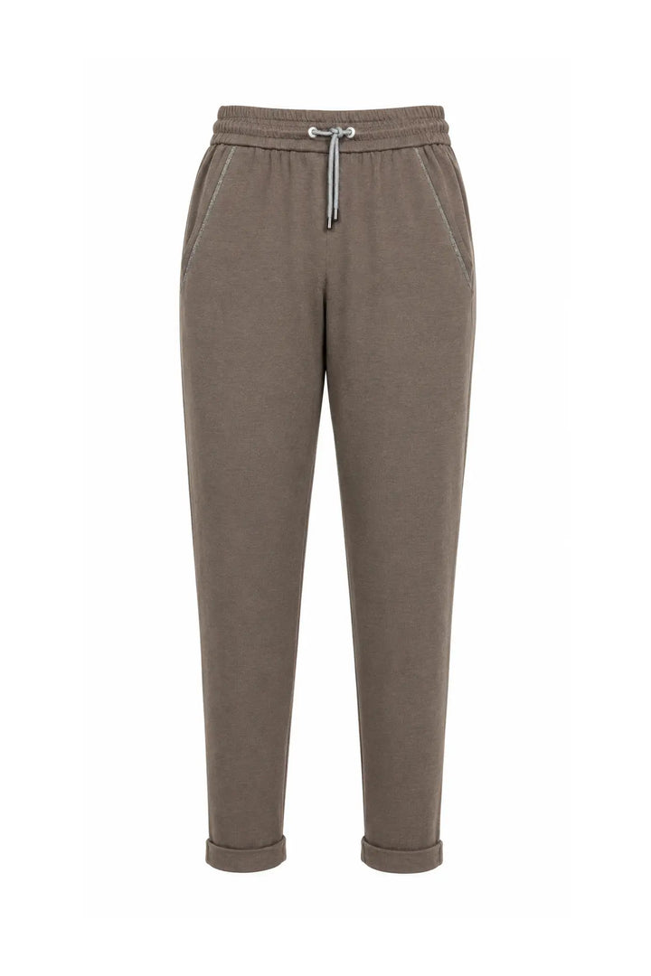 A pair of brown jogger-style pants with an elastic waistband, a silver drawstring, and side pockets, shown against a plain white background.