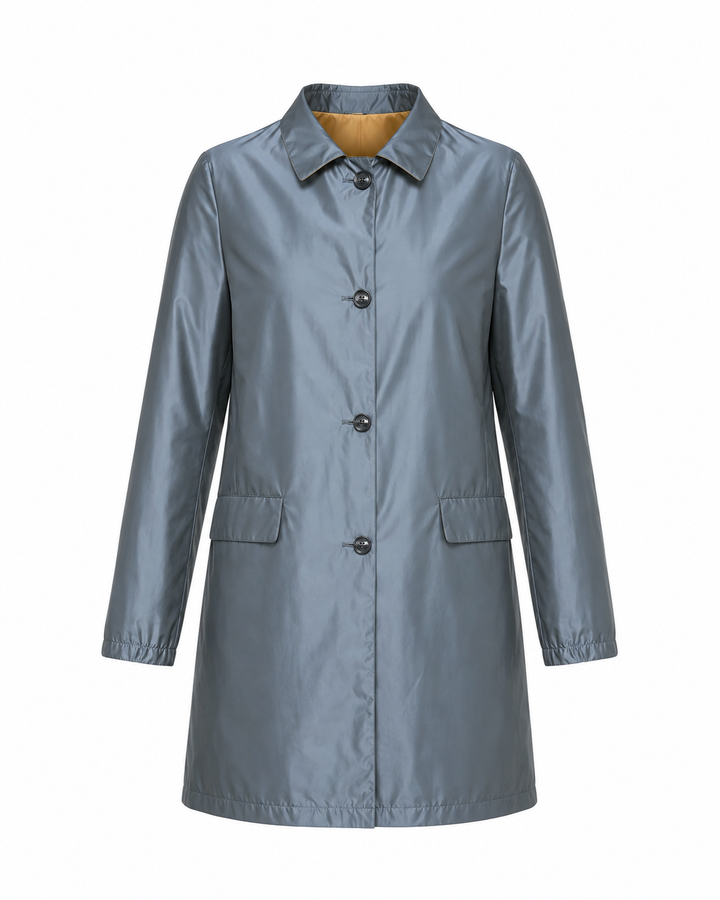 A slate blue-gray raincoat with a pointed collar, front button closure, and two front flap pockets, shown on a plain white background.