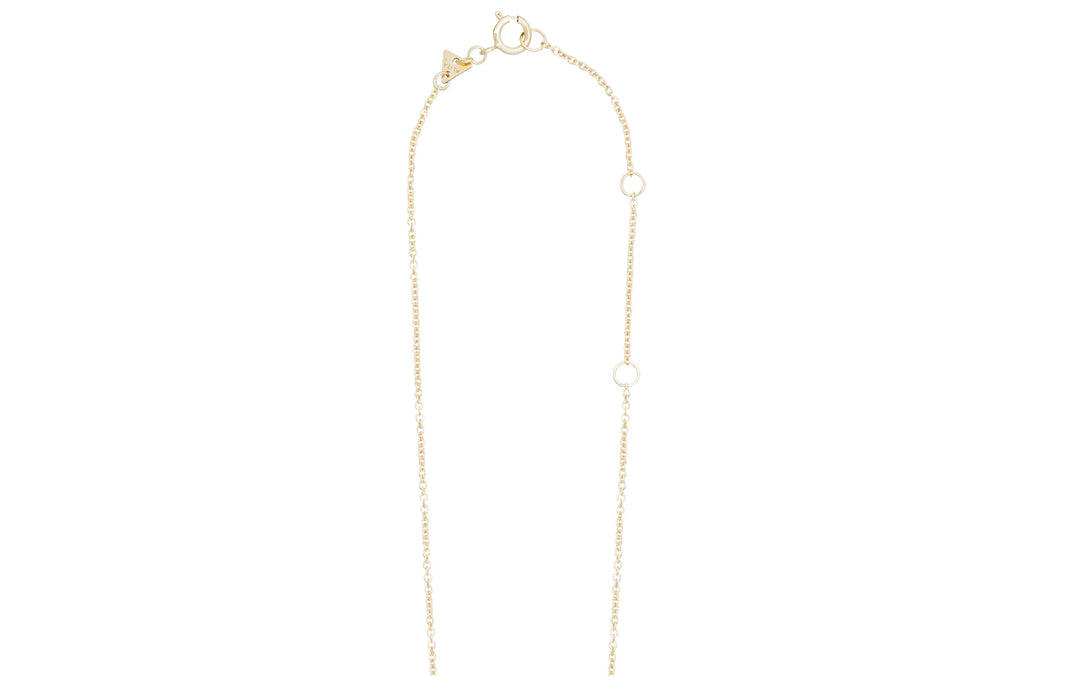 Gold necklace with small pearls on a white background