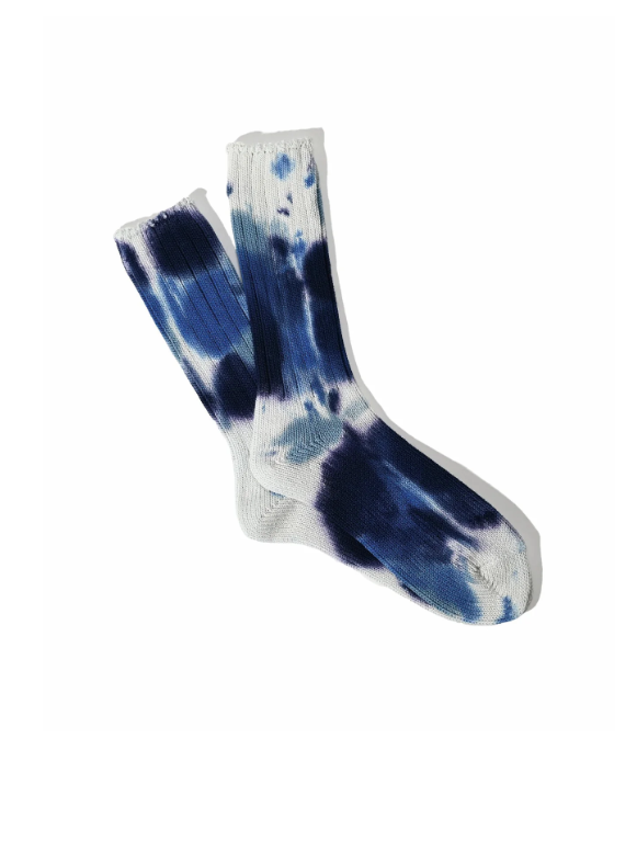 Tie-dye sock with blue and white pattern on a white background