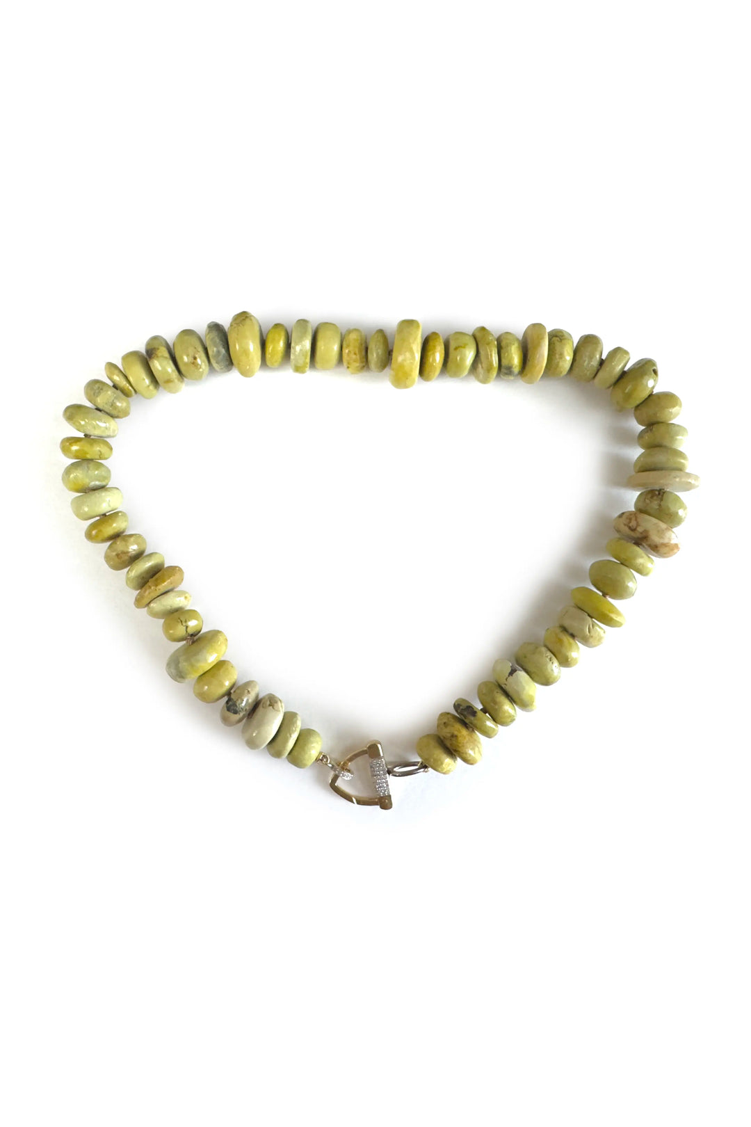 Beaded bracelet with a heart charm on a white background