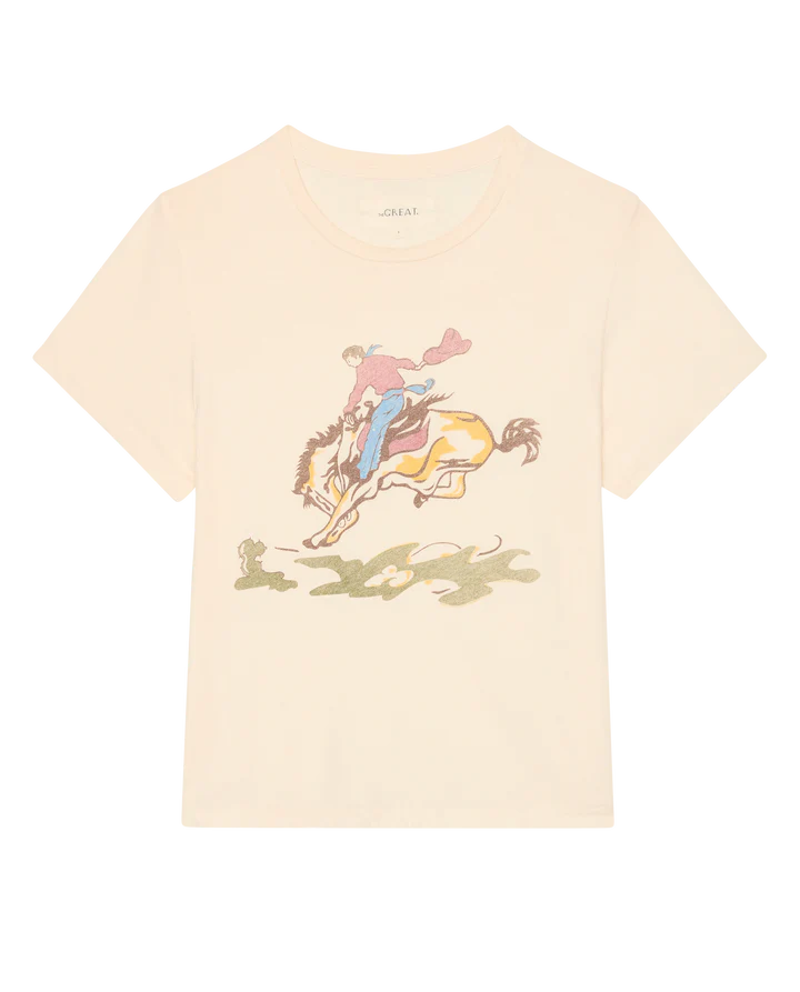 Beige t-shirt with graphic of a person riding a horse on a white background