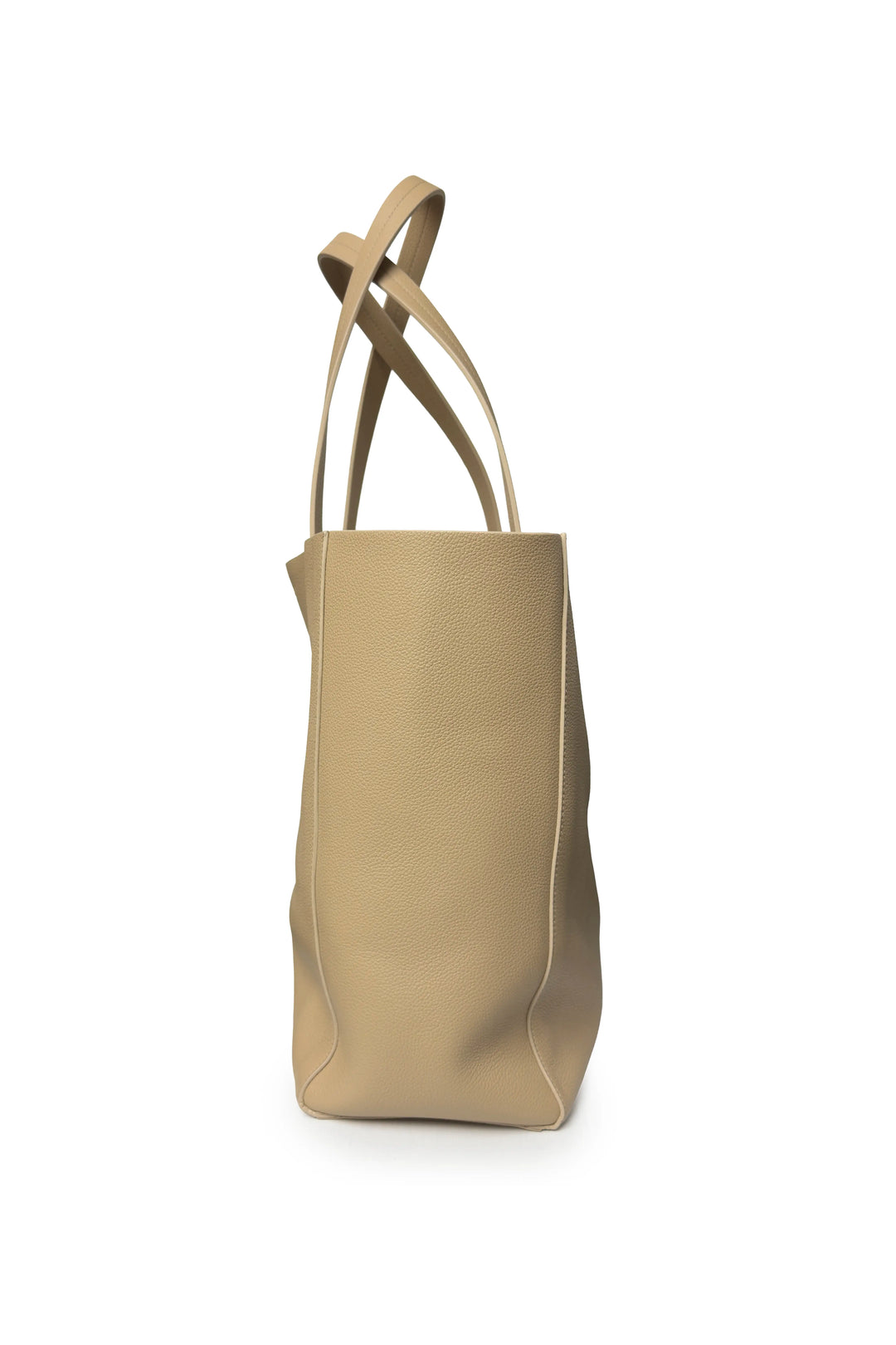 Beige tote bag with thin straps on a white background