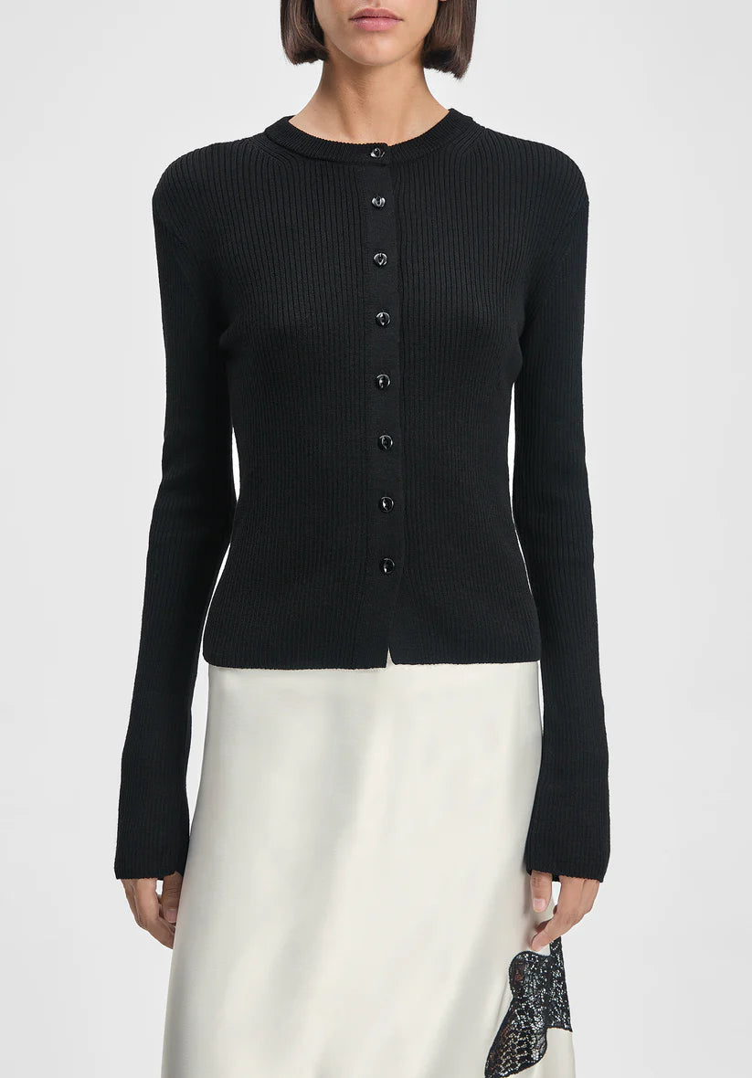 Black cardigan worn by a person on a white background