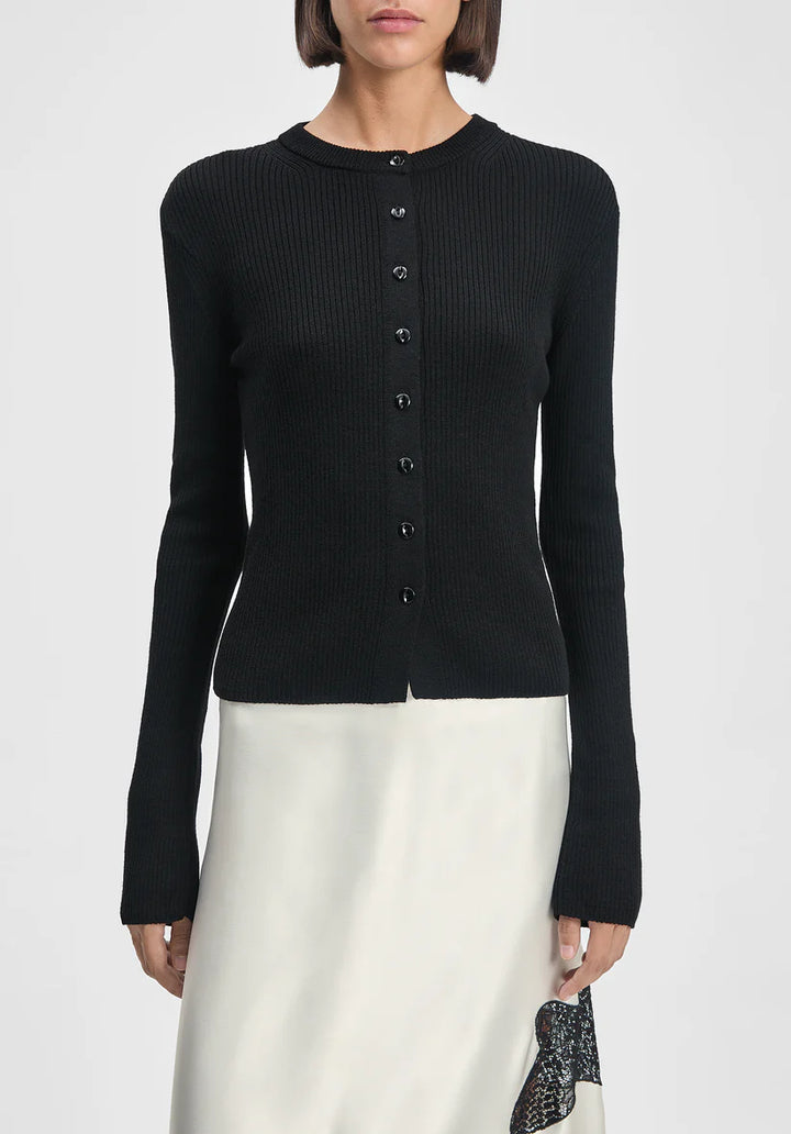 Black cardigan worn by a person on a white background