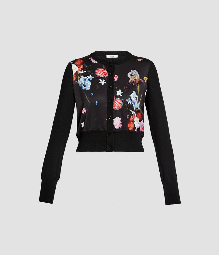 Black cardigan with colorful floral embroidery on a light gray background