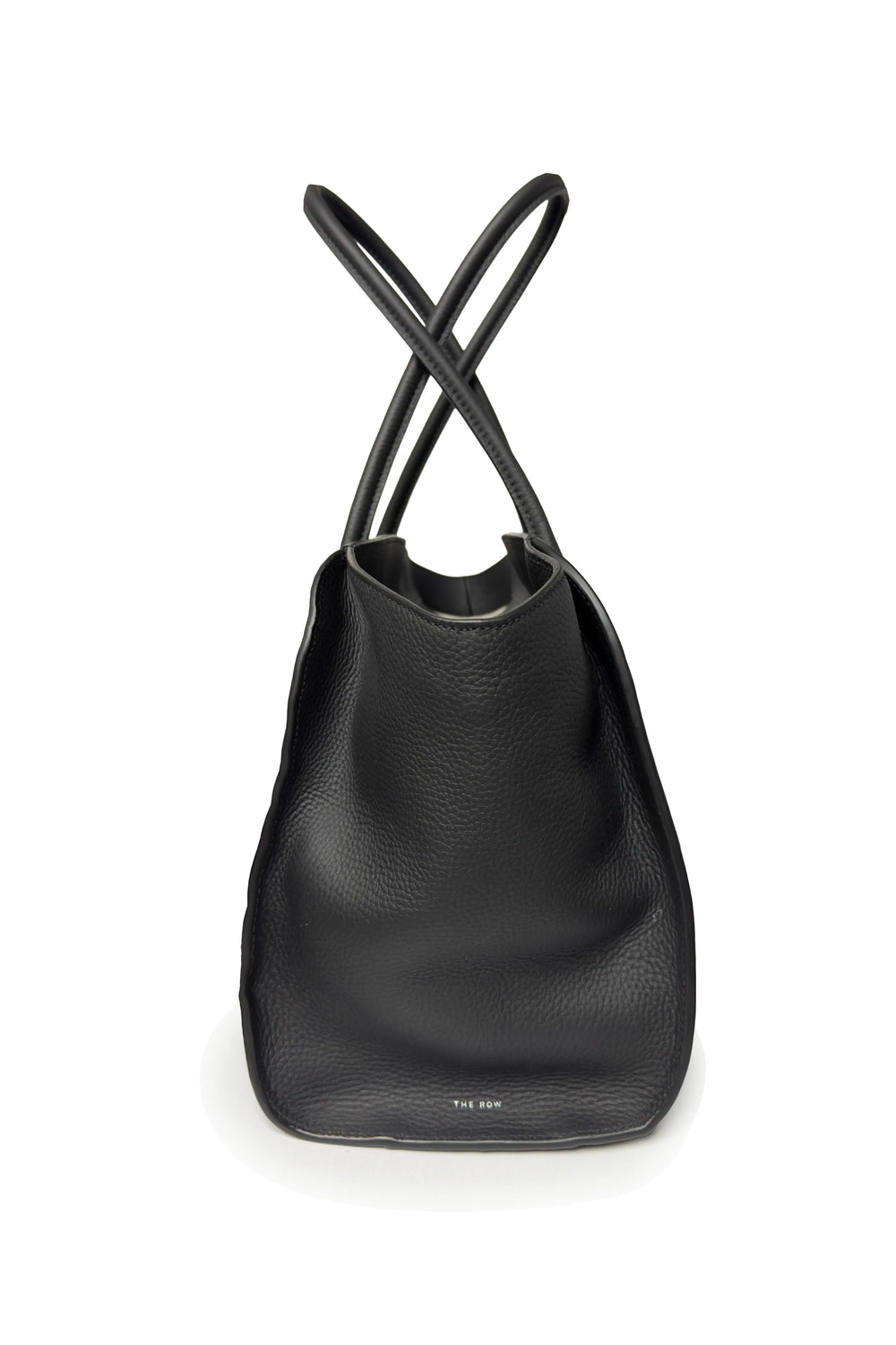 Black leather bag with criss-cross straps on a white background