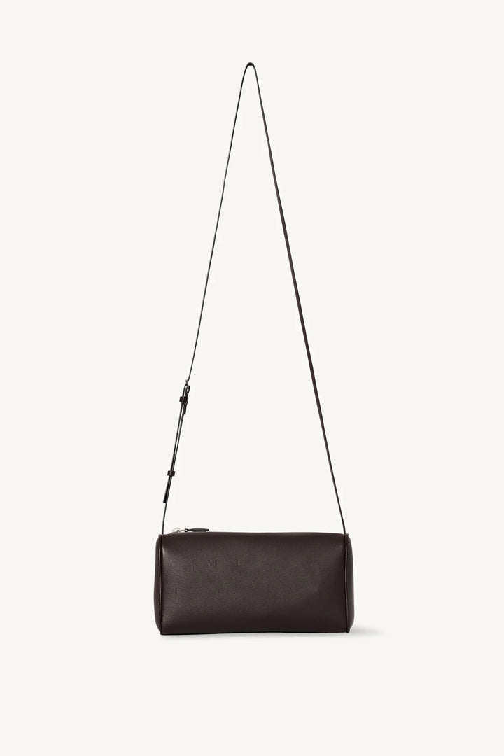 Black leather crossbody bag on a white background