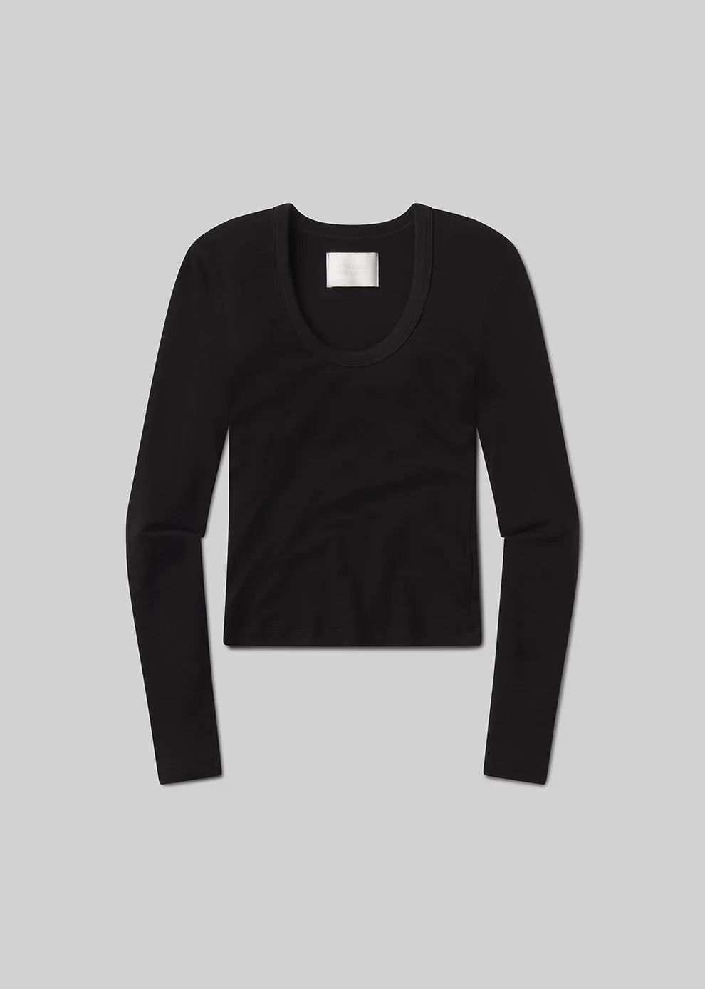 Black long-sleeve top on a gray background