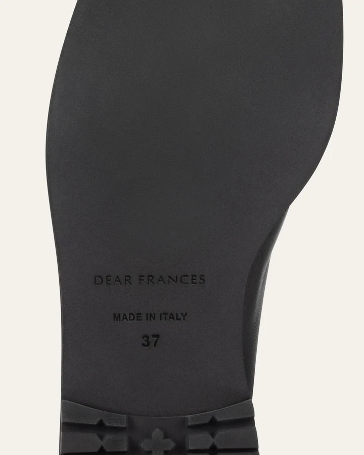 Black shoe sole with 'Dear Frances' branding and 'Made in Italy' text on a light gray background