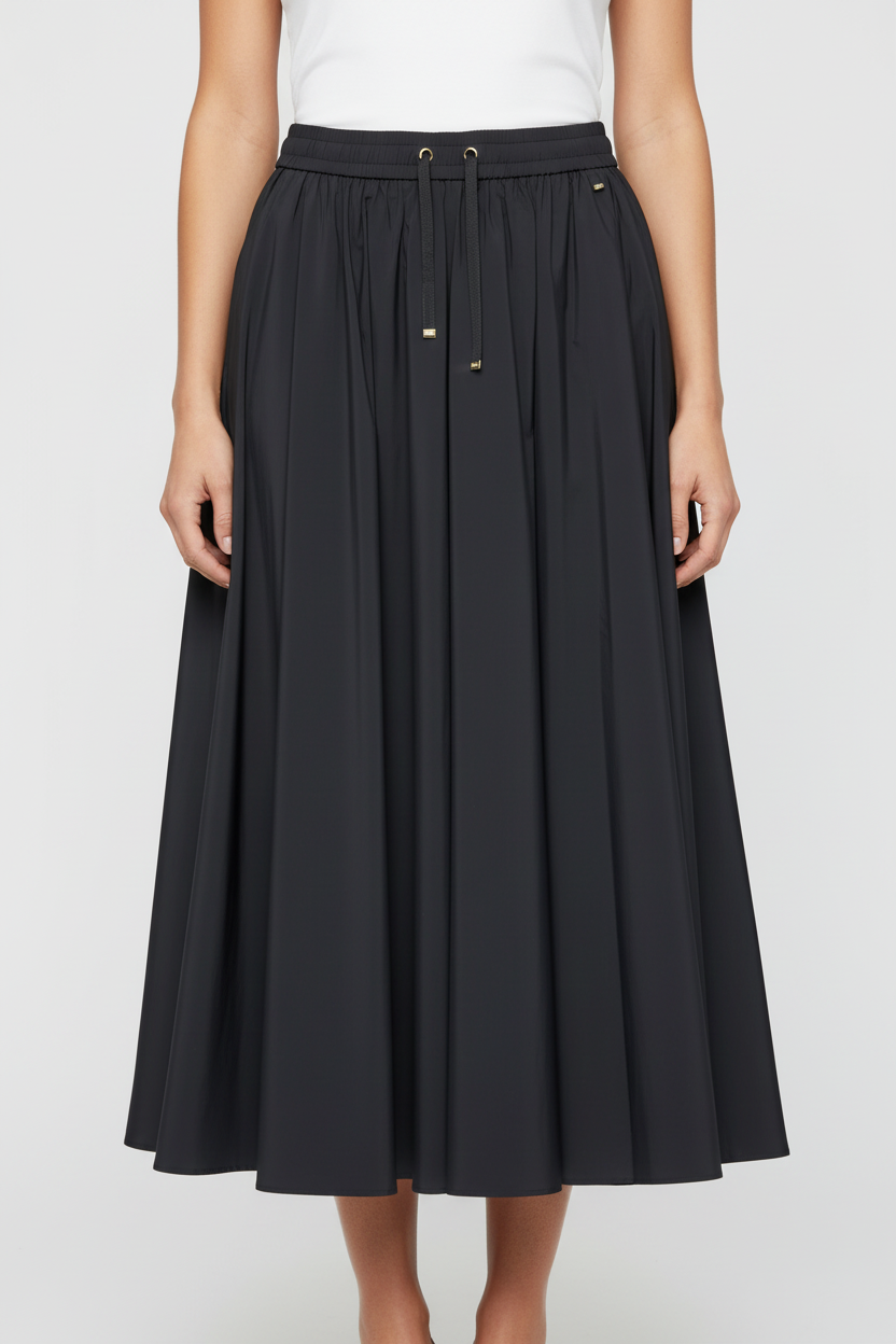 Black skirt worn by a person on a white background