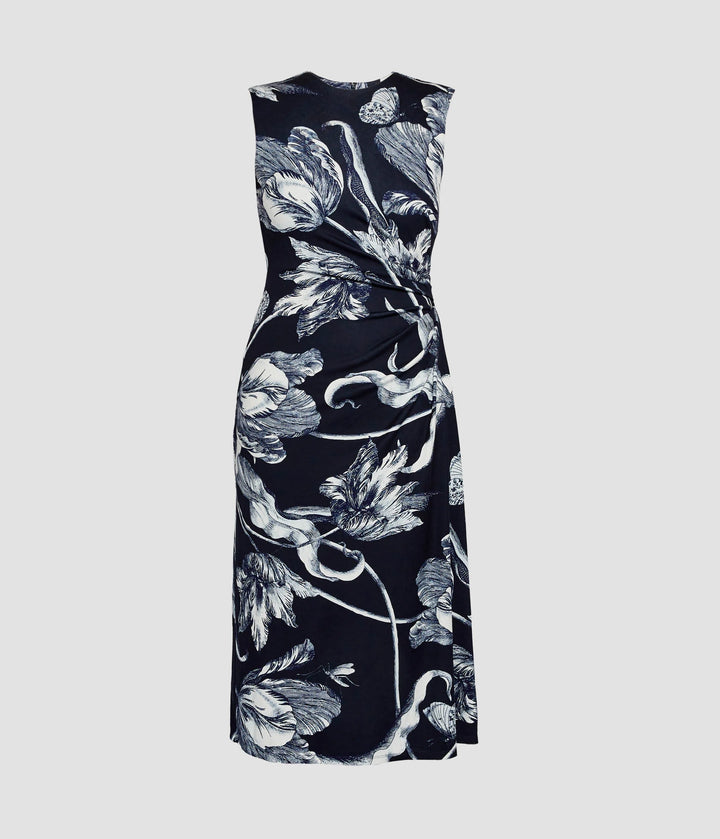 Black sleeveless dress with white floral pattern on a light gray background