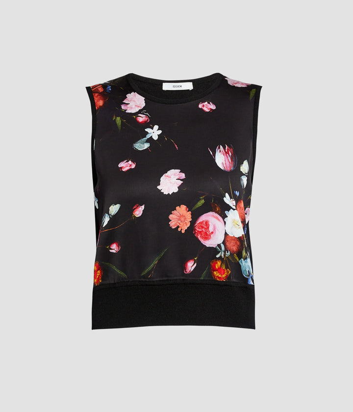 Black sleeveless top with colorful floral pattern on a light gray background