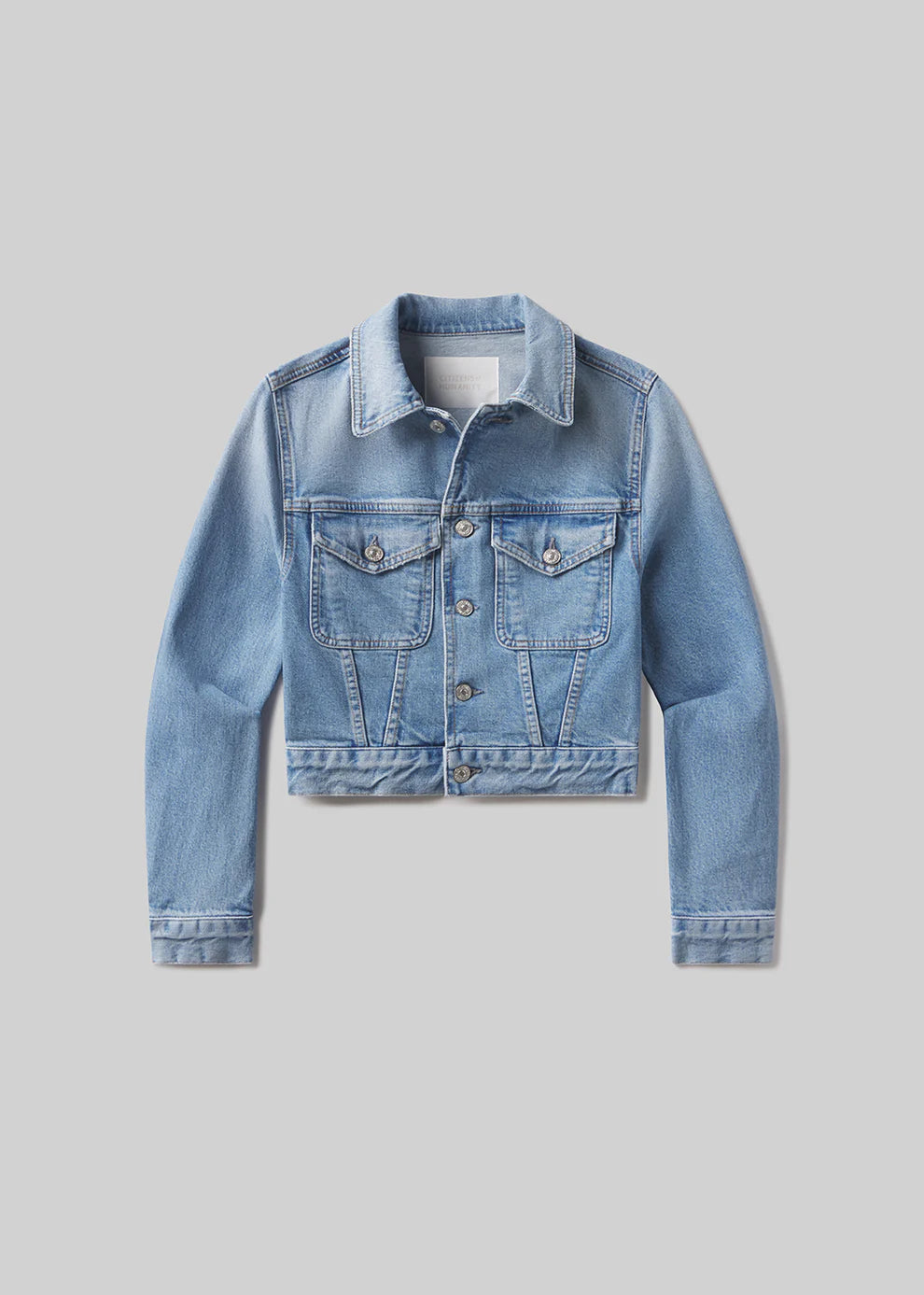 Blue denim jacket on a gray background