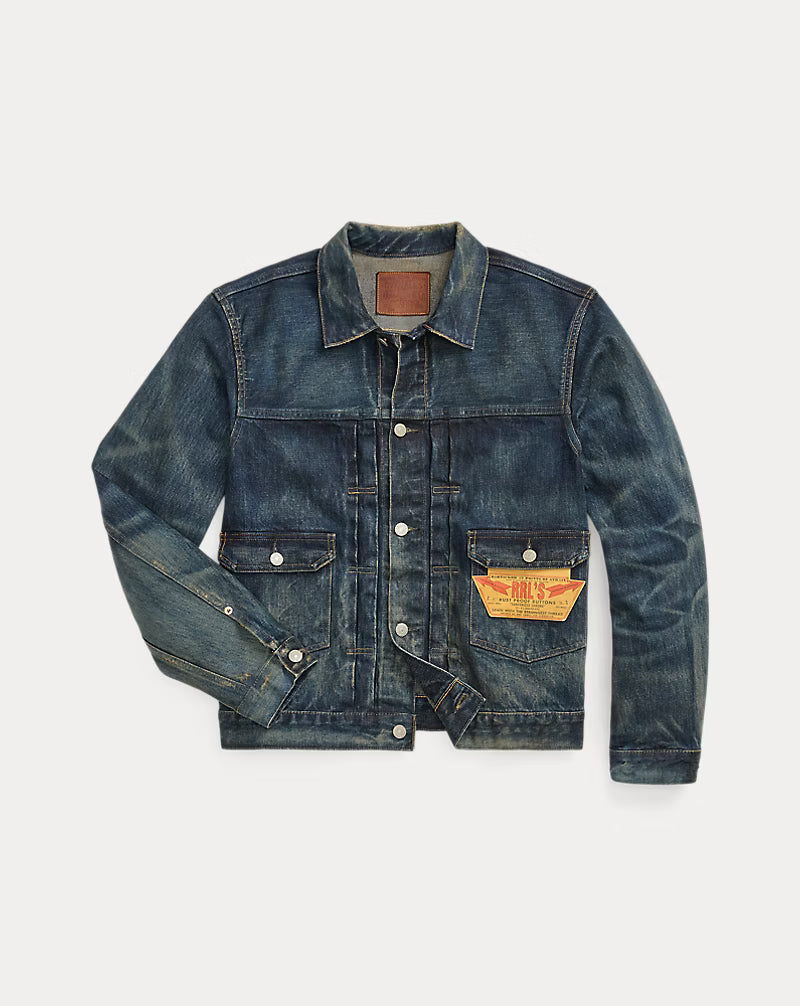 Blue denim jacket with brand patch on a light gray background