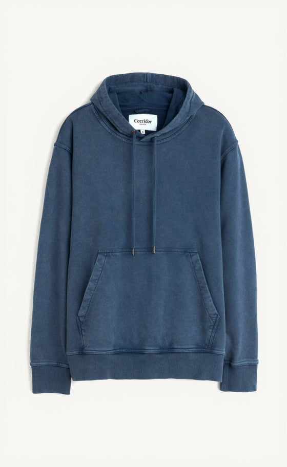 Blue hoodie with a visible brand label on a white background