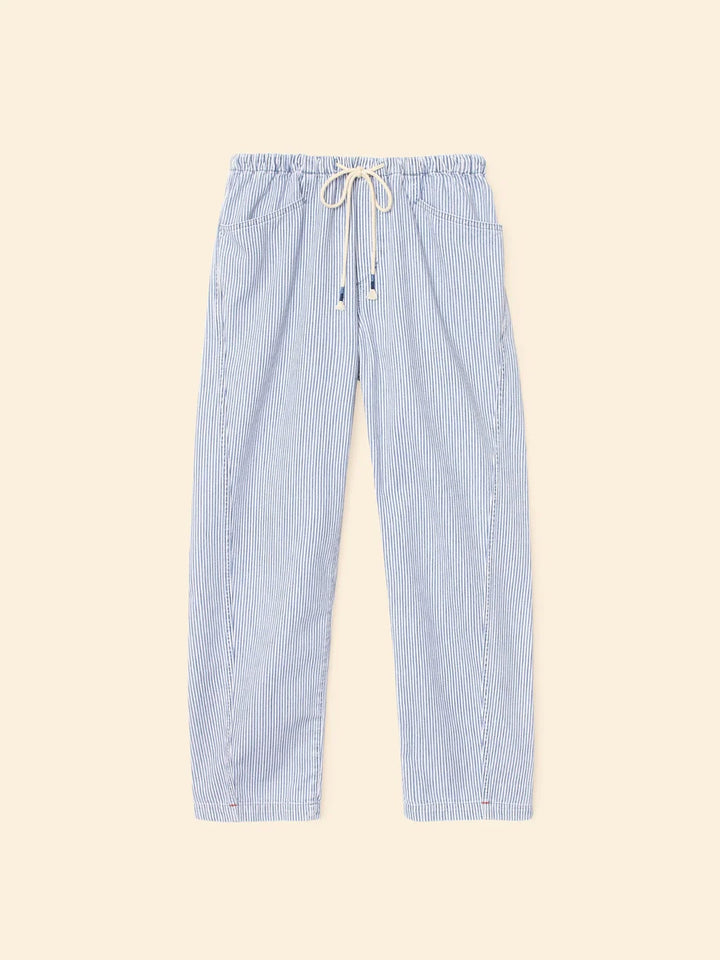 Blue striped pants on a beige background