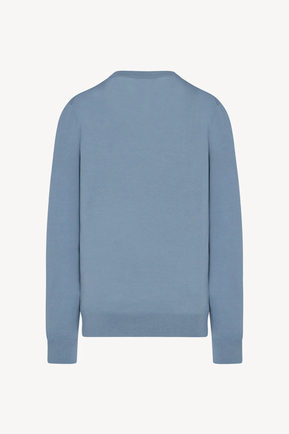 Blue sweater on a light gray background