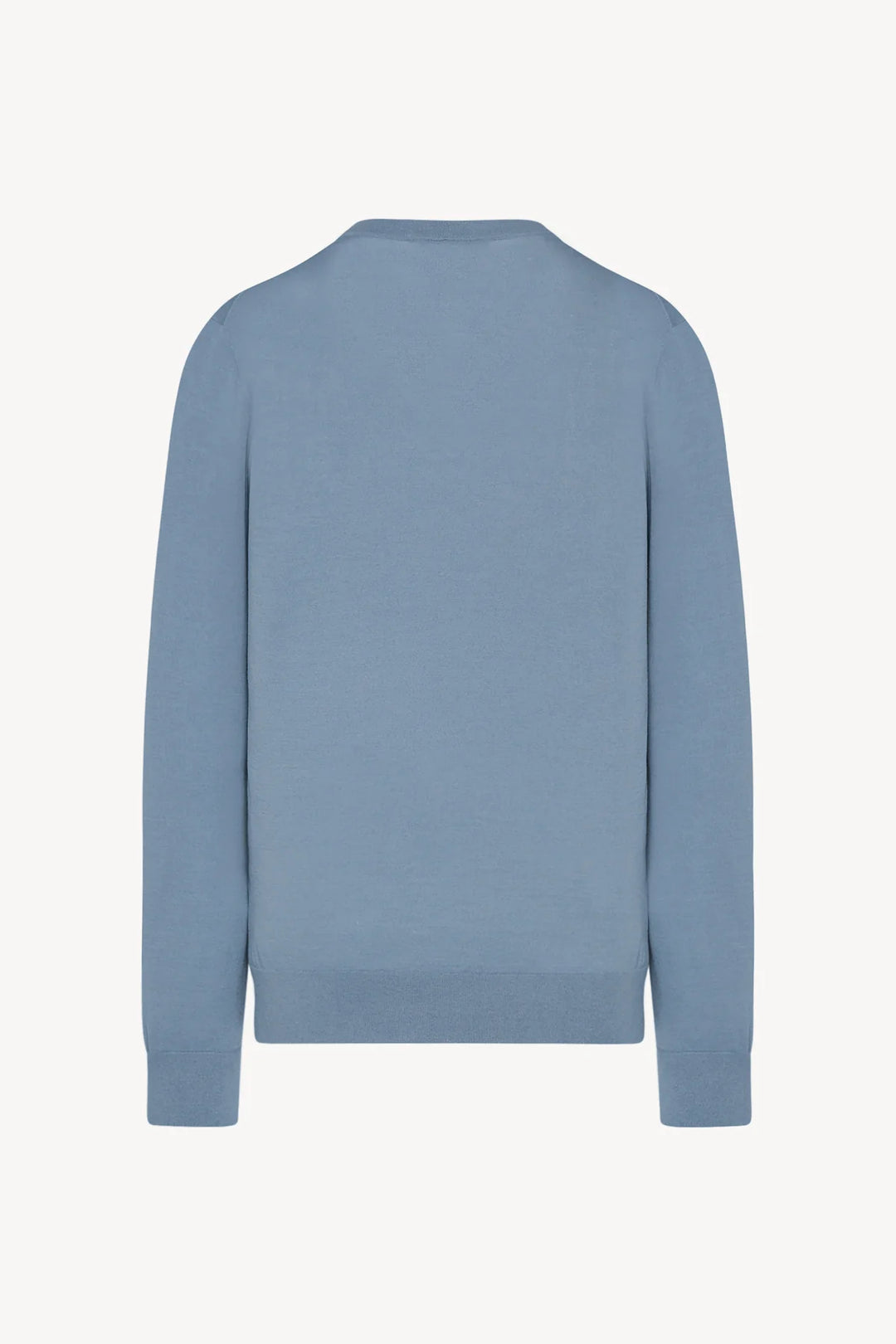 Blue sweater on a light gray background