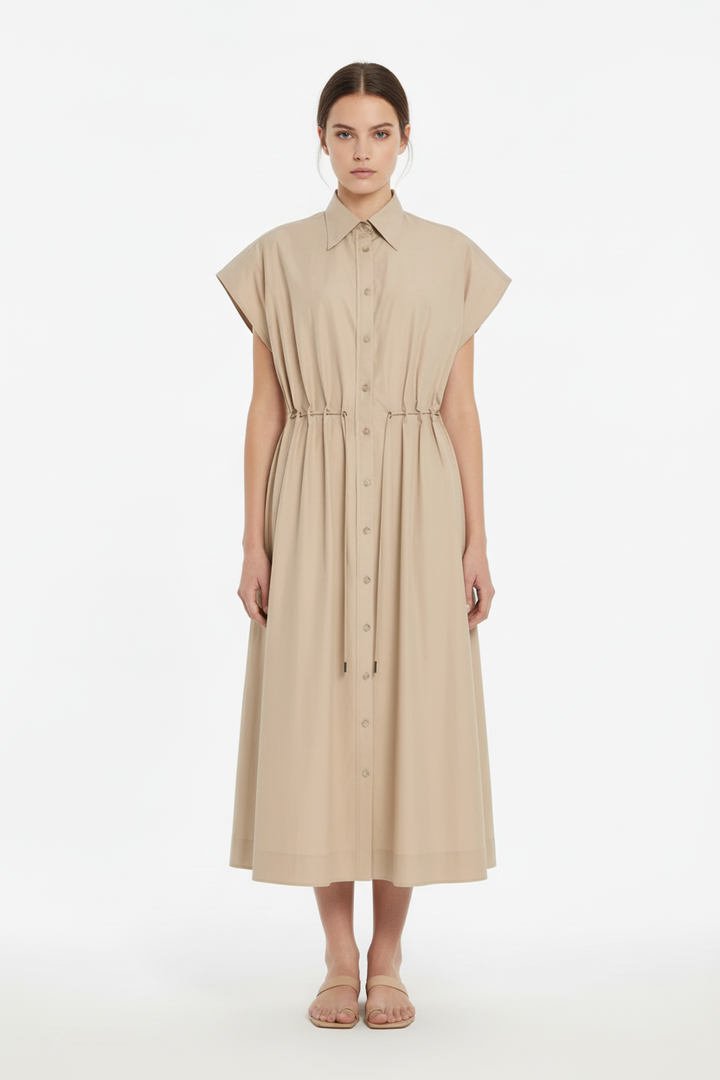 Woman wearing a beige sleeveless dress on a white background