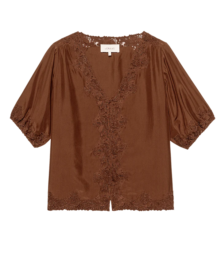 Brown blouse with lace details on a white background