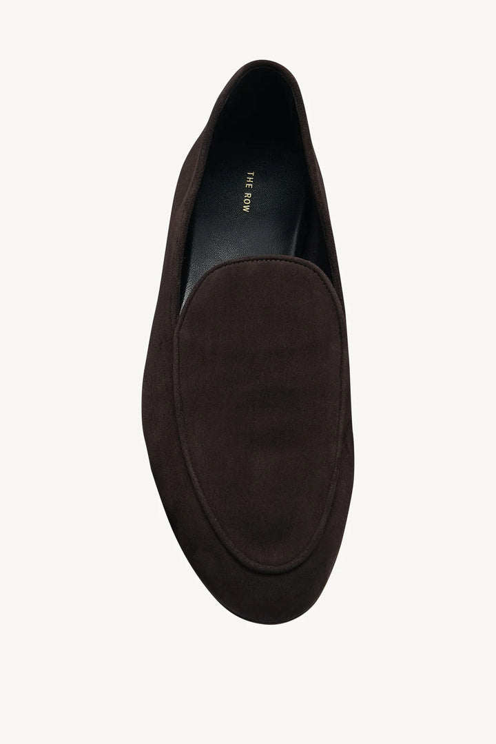 Brown suede loafer shoe on a white background