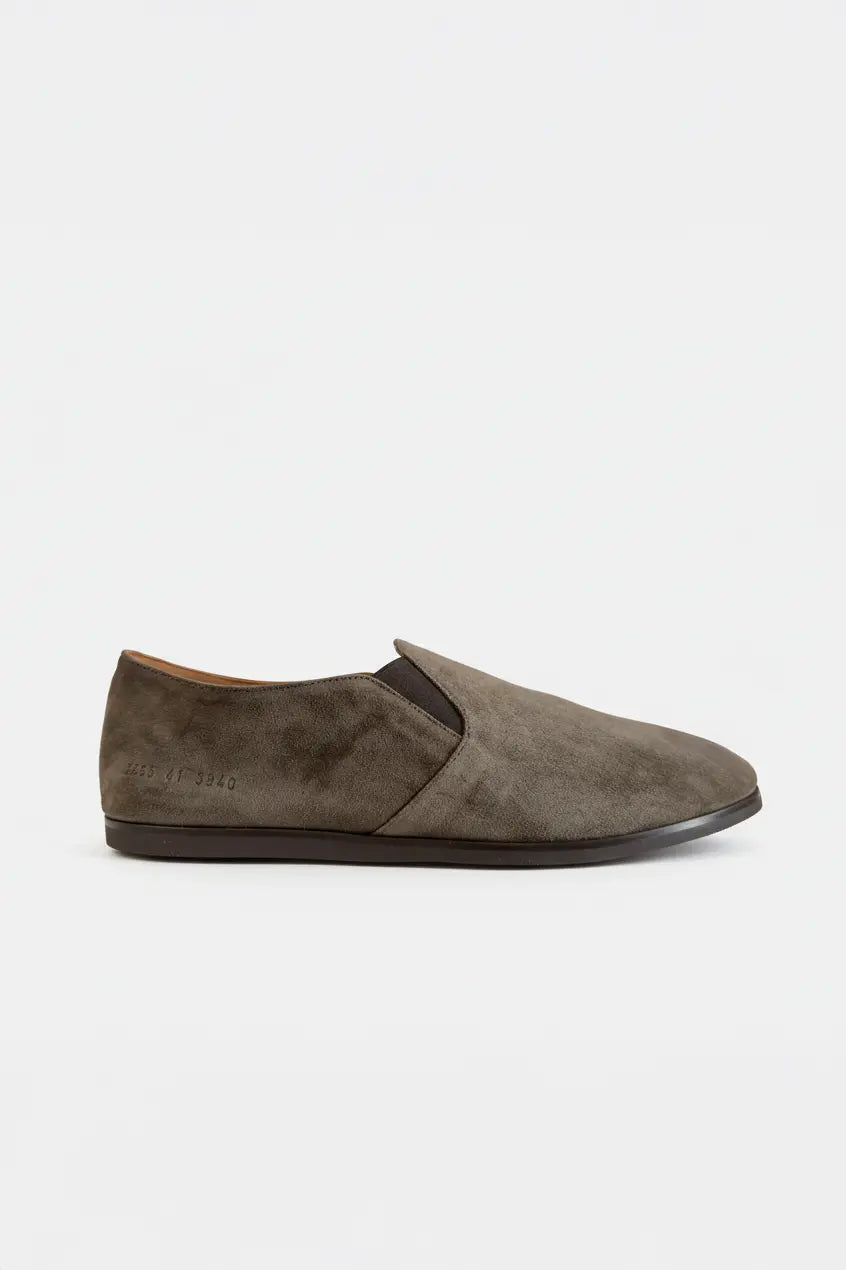 Brown suede slip-on shoe on a white background