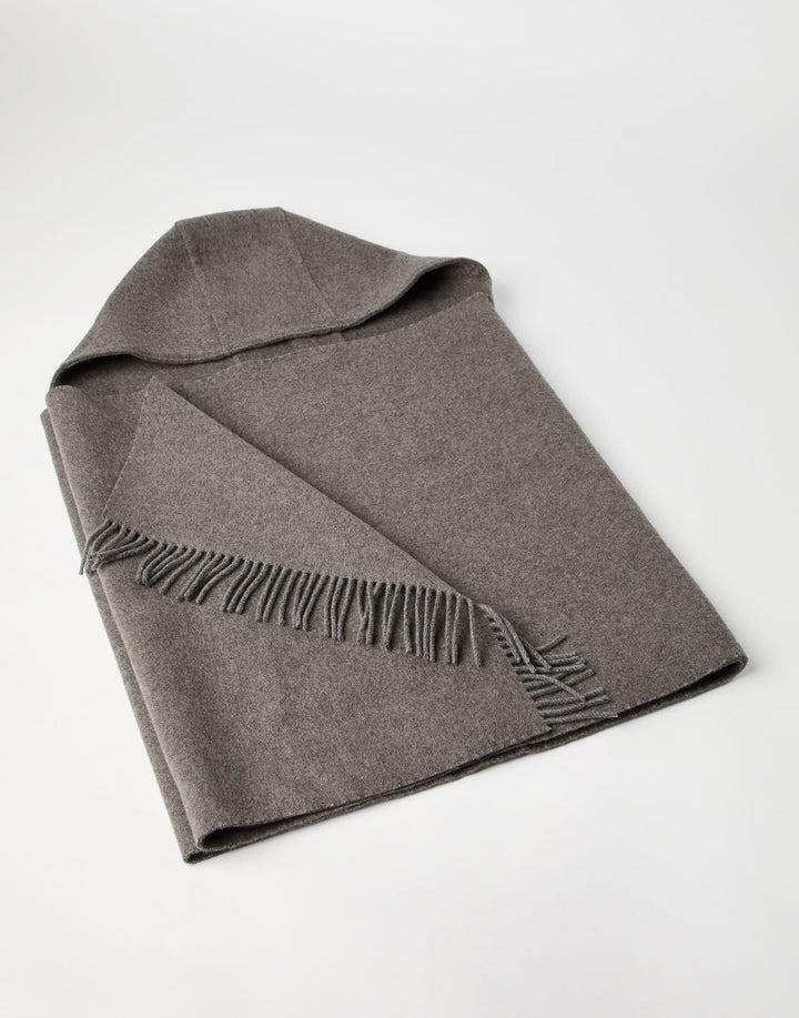 Gray blanket with fringes on a white background