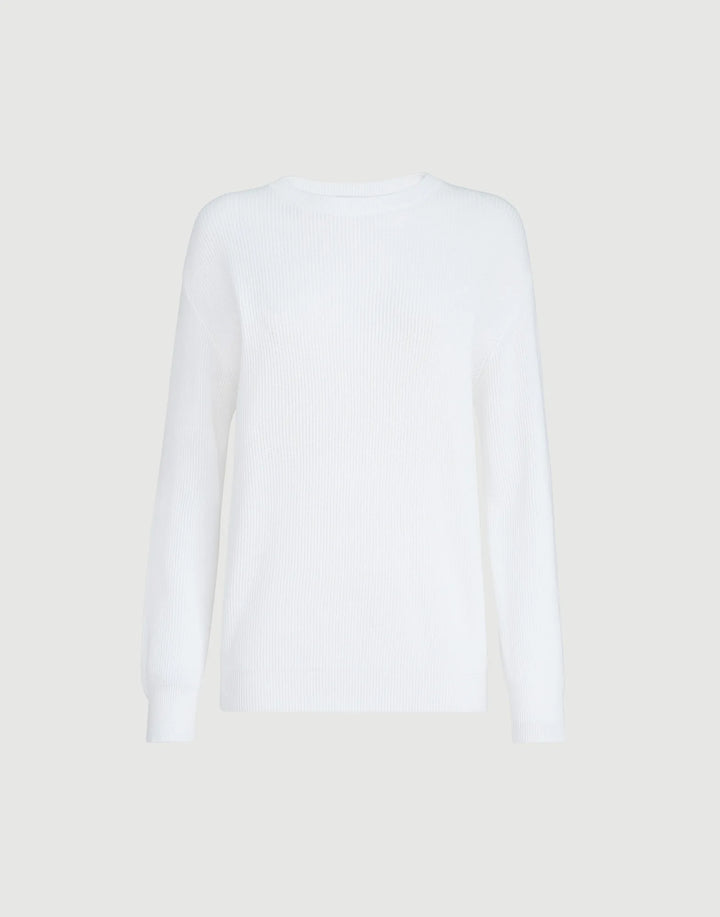 White long-sleeve shirt on a light beige background