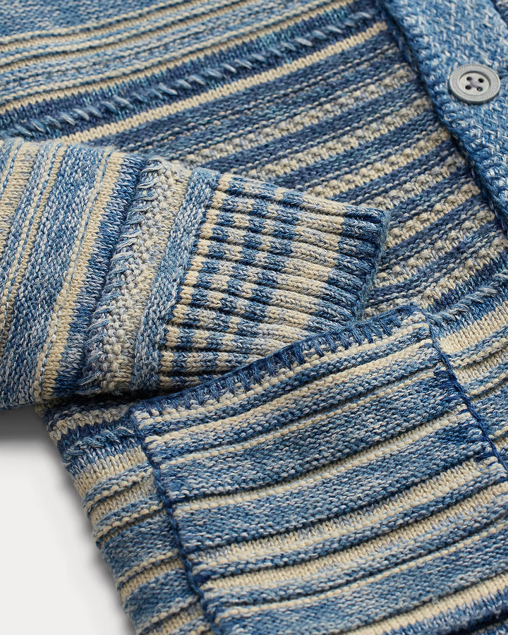 Close-up of a blue and beige striped fabric with a pocket.