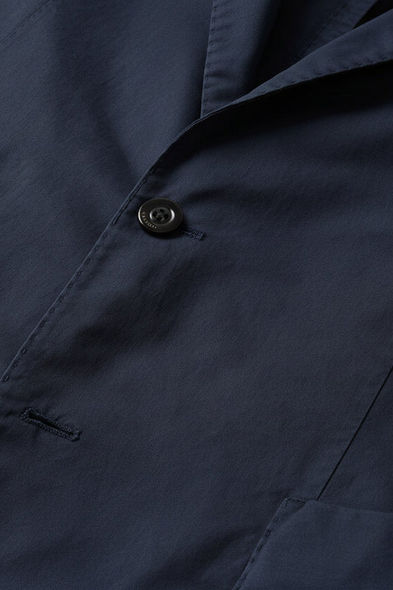 Close-up of a navy blue fabric with a button