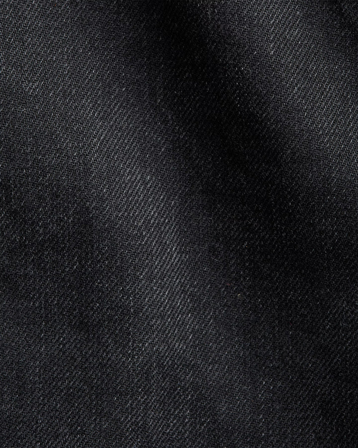 Close-up of black denim fabric texture